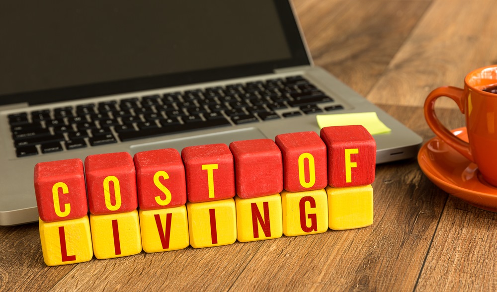 Cost of living spelled out on blocks