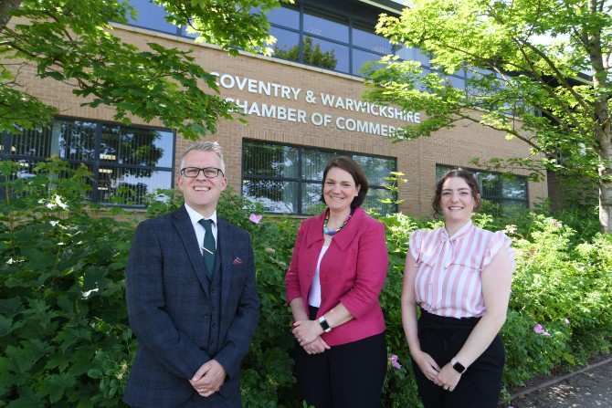Three people standing outside the Coventry & Warwickshire Chamber of Commerce