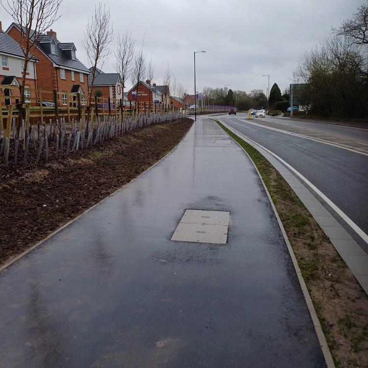 Image of improved road by housing estate