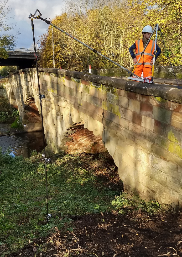 Bill Harvey associates taking 3D pictures of bridge