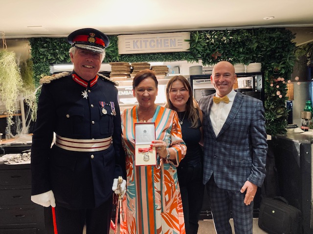 Photo (from left to right): Lord Lieutenant Tim Cox, Joanne Horne, and Joanne’s family.