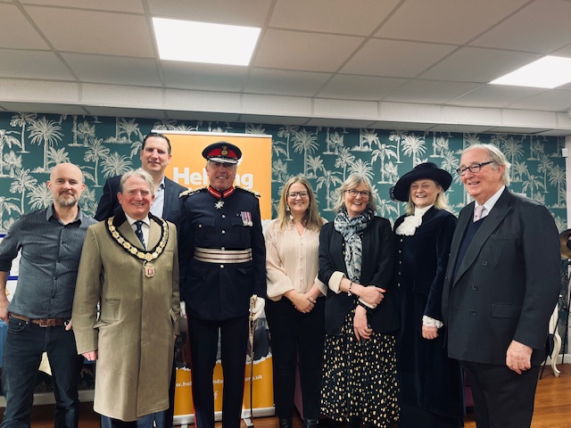 Lianne Kirkman (centre) being presented with the KAVS for Helping Hands Community Project by Lord Lieutenant Tim Cox.