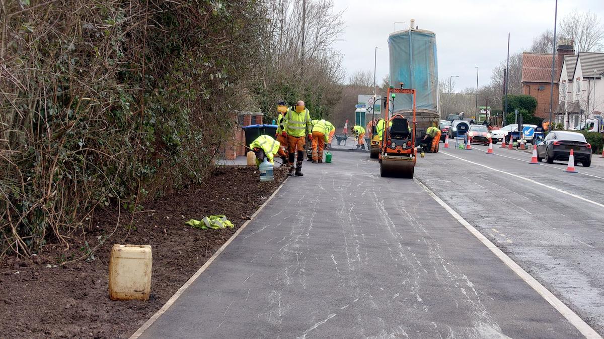 Contractor is finishing the surface course to the outbound footway between Worths Way and Squirrels Street.