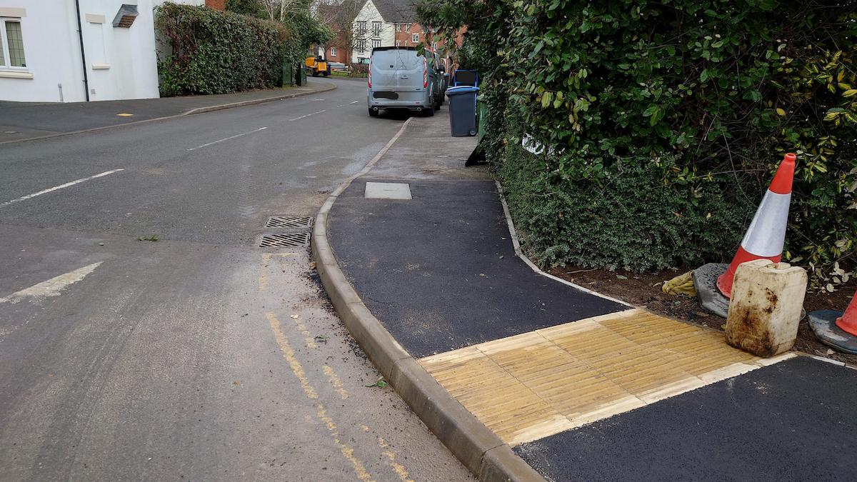 Existing Give Way sign relocated for easier access to and from Worths Way along the northern footway