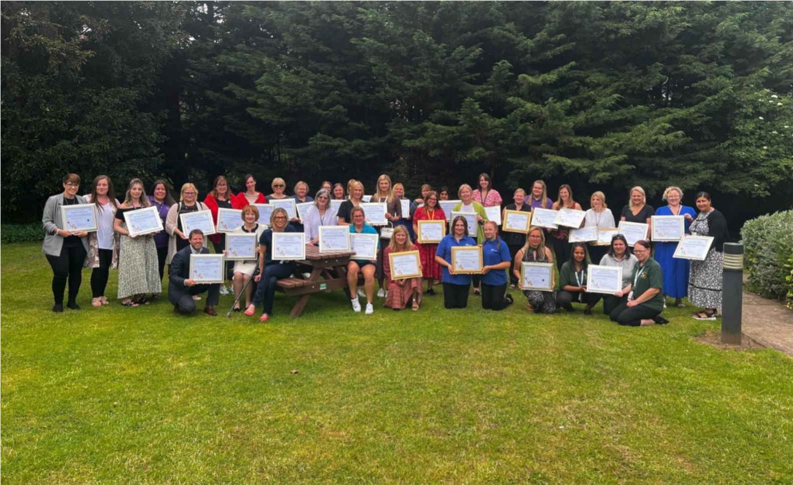 Photograph of representatives from the early years settings with their WIncKS Award certificates