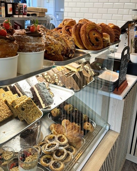 A display case with pastries and pastries