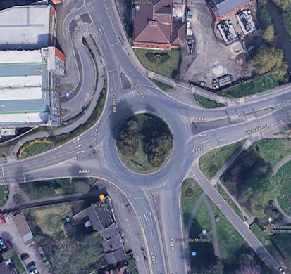 Aerial image of the current road layout, showing little-to-no markings on the roundabout