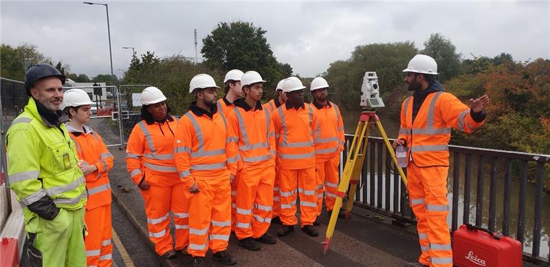 8 workers wearing high viz jackets